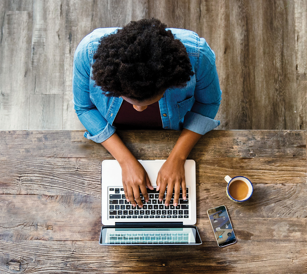 Top view of person working on a laptop